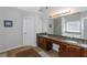 Bathroom with double vanity and granite countertop at 1912 Wheat Valley Cir, Conyers, GA 30013