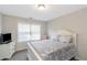 Guest bedroom with window and neutral decor at 1912 Wheat Valley Cir, Conyers, GA 30013