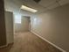 Spacious finished basement with neutral carpeting and large windows at 5226 Oaktree Trl, Lithonia, GA 30038