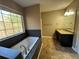 Main bathroom with soaking tub, double vanity and tile shower at 5226 Oaktree Trl, Lithonia, GA 30038