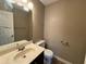 Small bathroom with single sink and toilet at 5226 Oaktree Trl, Lithonia, GA 30038