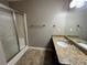 Bathroom with granite countertop, double sinks, and shower at 5226 Oaktree Trl, Lithonia, GA 30038