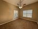 Bright bedroom with ceiling fan and neutral carpeting at 5226 Oaktree Trl, Lithonia, GA 30038