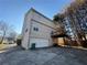 Home exterior with attached garage and deck at 5226 Oaktree Trl, Lithonia, GA 30038