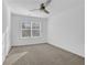 Bright bedroom with carpet, ceiling fan and large window at , Stone Mountain, GA 30083