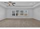 Spacious bedroom with neutral carpeting and large windows at , Stone Mountain, GA 30083