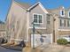 Side view of townhome showcasing gray siding and brick details at , Stone Mountain, GA 30083