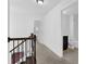 Upstairs hallway with carpet and access to bedrooms and bathroom at , Stone Mountain, GA 30083