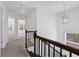 Upstairs hallway with carpet, doors to bedrooms, and a chandelier at , Stone Mountain, GA 30083