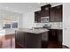 Modern kitchen with dark cabinetry, granite countertops, and island at , Stone Mountain, GA 30083