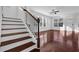 Elegant staircase with dark wood railing and hardwood floors at , Stone Mountain, GA 30083