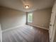 Well-lit bedroom with large window and plush carpeting at 300 River Birch Ct, Canton, GA 30114