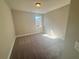 Bright bedroom with neutral walls, carpet flooring, and a window at 300 River Birch Ct, Canton, GA 30114