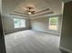 Bright bedroom featuring a ceiling fan and ample natural light at 300 River Birch Ct, Canton, GA 30114