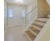 Tiled entryway with staircase and front door at 6027 Wintergreen Rd, Norcross, GA 30093