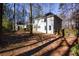 House with a fenced backyard and mature trees at 1080 Willow Bnd, Roswell, GA 30075