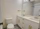 Bathroom with double vanity, updated fixtures, and patterned floor at 1080 Willow Bnd, Roswell, GA 30075