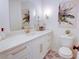 Modern bathroom with white vanity, gold accents, and patterned floor at 1080 Willow Bnd, Roswell, GA 30075