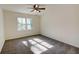 Bright bedroom with ceiling fan and large window at 1080 Willow Bnd, Roswell, GA 30075