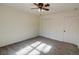 Bright bedroom with ceiling fan, carpet, and window at 1080 Willow Bnd, Roswell, GA 30075