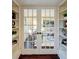 Built-in shelves flanking French doors leading to a living area at 1080 Willow Bnd, Roswell, GA 30075