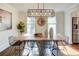 Bright dining room with hardwood floors, large windows, and stylish decor at 1080 Willow Bnd, Roswell, GA 30075