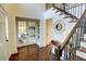 Bright entryway with hardwood floors, French doors, and elegant staircase at 1080 Willow Bnd, Roswell, GA 30075