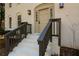 Front entrance with a taupe door, dark brown railings, and white brick steps at 1080 Willow Bnd, Roswell, GA 30075