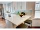 Kitchen island with seating and white quartz countertops at 1080 Willow Bnd, Roswell, GA 30075