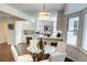 Bright kitchen with a glass dining table and white chairs at 1080 Willow Bnd, Roswell, GA 30075