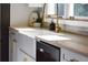 Modern kitchen sink with gold faucet and white quartz countertops at 1080 Willow Bnd, Roswell, GA 30075