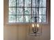 Black chandelier hangs in front of a large window at 1080 Willow Bnd, Roswell, GA 30075