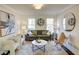 Living room with gray sofa, armchairs, and coffee table at 1080 Willow Bnd, Roswell, GA 30075