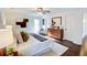 Main bedroom with hardwood floors, a ceiling fan, and modern decor at 1080 Willow Bnd, Roswell, GA 30075