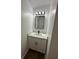 Cozy bathroom featuring white marble countertop, black hardware, and modern vanity at 205 Hardman Way, Woodstock, GA 30188