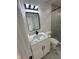 Bathroom featuring a stylish vanity with marble countertop and modern lighting fixtures at 205 Hardman Way, Woodstock, GA 30188