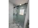 Bright bathroom featuring glass enclosed shower and sleek black hardware at 205 Hardman Way, Woodstock, GA 30188