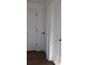 Bright hallway with hardwood floors and white doors at 205 Hardman Way, Woodstock, GA 30188