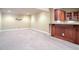 Finished basement with carpeted floors, neutral walls, recessed lights, and a beautiful bar area at 2602 Alcovy Club Dr, Dacula, GA 30019