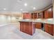 Basement bar and entertaining area with custom cabinetry and granite countertops at 2602 Alcovy Club Dr, Dacula, GA 30019
