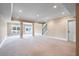 Spacious basement with carpet and columns that lead to the exterior at 2602 Alcovy Club Dr, Dacula, GA 30019