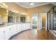Bathroom featuring dual sinks, granite counters, and separate tub and shower at 2602 Alcovy Club Dr, Dacula, GA 30019