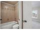 Bathroom with a bathtub, ceramic tile shower, a toilet, and a shower head at 2602 Alcovy Club Dr, Dacula, GA 30019