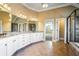 Bathroom with dual sinks, granite countertops, tiled floor, and a large glass shower enclosure at 2602 Alcovy Club Dr, Dacula, GA 30019