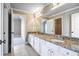 Bathroom featuring granite counters, dual sinks, and tile floors at 2602 Alcovy Club Dr, Dacula, GA 30019
