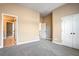 Bedroom with carpet, neutral colored walls, and white doors at 2602 Alcovy Club Dr, Dacula, GA 30019