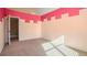 Bedroom with carpet and pink trim painted along the ceiling at 2602 Alcovy Club Dr, Dacula, GA 30019