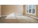 This cozy bedroom has carpet and a view of the yard at 2602 Alcovy Club Dr, Dacula, GA 30019