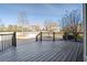 A deck area featuring a wood-like flooring with a railing and a serene outdoor view at 2602 Alcovy Club Dr, Dacula, GA 30019