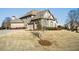 Exterior view of a home with landscaping and a three-car garage at 2602 Alcovy Club Dr, Dacula, GA 30019